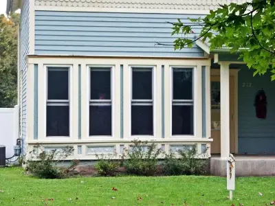 Century-old home window replacement — Roofing & Gutter Services project by Midwest Construction & Supply INC
