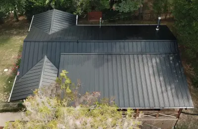 Matte Black Standing Seam at Lake Austin — Roofing & Gutter Services project by Green Knight Metal Roofing