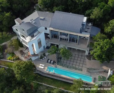Curved Panels with Standing Seam — Roofing & Gutter Services project by Green Knight Metal Roofing