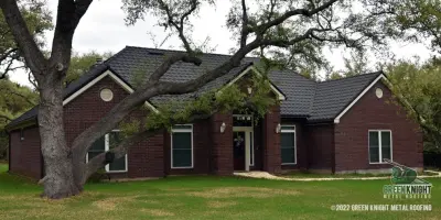 Steel Barrel Vault with Stone Coating — Roofing & Gutter Services project by Green Knight Metal Roofing