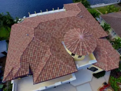 Waterfront Sunrise Key Tile Roofing — Roofing & Gutter Services project by Evans Roofing