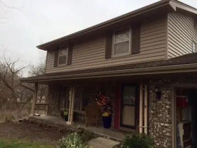 Installation of American Classic Insulated Siding for Windsor Heights Homeowners — Roofing & Gutter Services project by Midwest Construction & Supply INC