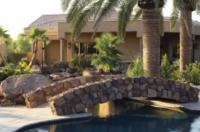 Accolade-Worthy Pool with Appalachian Field Stone Exterior - Coronado Stone — Design-Build Services project by Red Rock Design-Build And Red Rock Pools And Spas