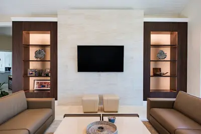 Custom Built-In Fireplace and Media Wall in Naples, FL — Design-Build Services project by Reed Design Build, LLC