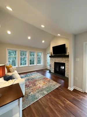 Expansion: Two-Car Garage, Spacious Living Area, Screened Porch & Indoor-Outdoor Fireplace — Design-Build Services project by Tatcor Design Build