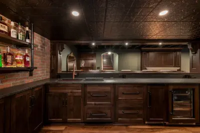 Akron Basement Renovation Featuring a Comfortable Media Space and Custom Bar — Design-Build Services project by Hurst Design Build Remodel