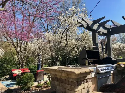 Garden Grill Area with Blooming Trees — Design-Build Services project by Surroundings By Natureworks