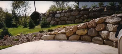 Boulder Retaining Walls — Landscape Construction project by Maple Hill Forest Inc.