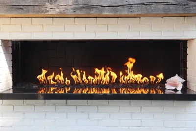 Modern patio with fireplace by City Garden Company