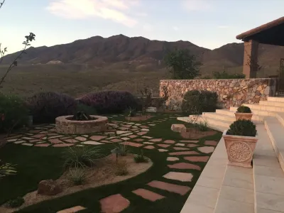 El Paso Franklin Mountain Home turf with flagstone — Landscape Construction project by Southwest Greens New Mexico