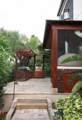 Siesta Key outdoor kitchen, bar, pizza oven — Landscape Design project by Design Scapes