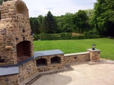 Historic Home Gets New Outdoor Fireplace by Earth, Turf & Blooms