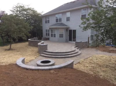 Mendham, NJ. Replacing an Old Deck with a New Raised Stone Patio by Earth, Turf & Blooms