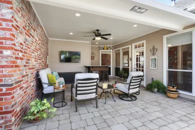 Covered Porch Extension — Landscape Design project by Smith + Baker in Baton Rouge