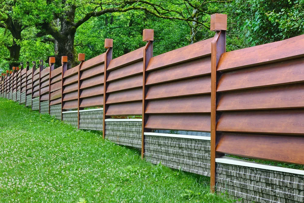 How to Install a Fence on Uneven Ground Without Costly Mistakes